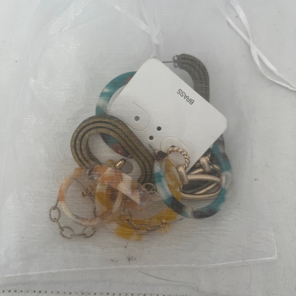 Small bag of assorted earrings